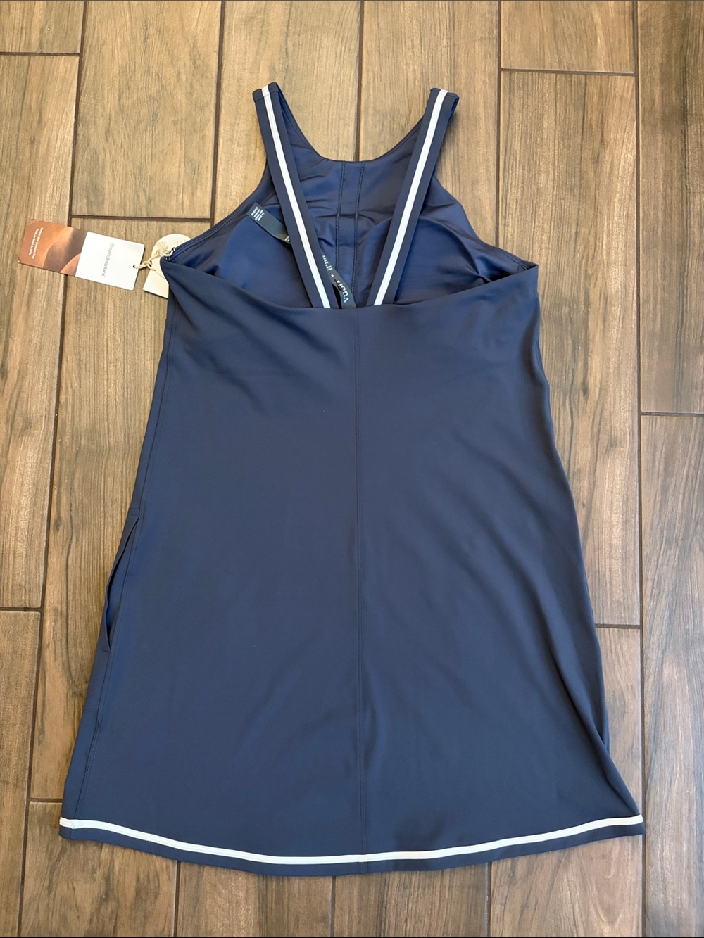 NWT Vuori Volley dress in azure blue featuring white trim and a built in bra - Picture 6 of 9